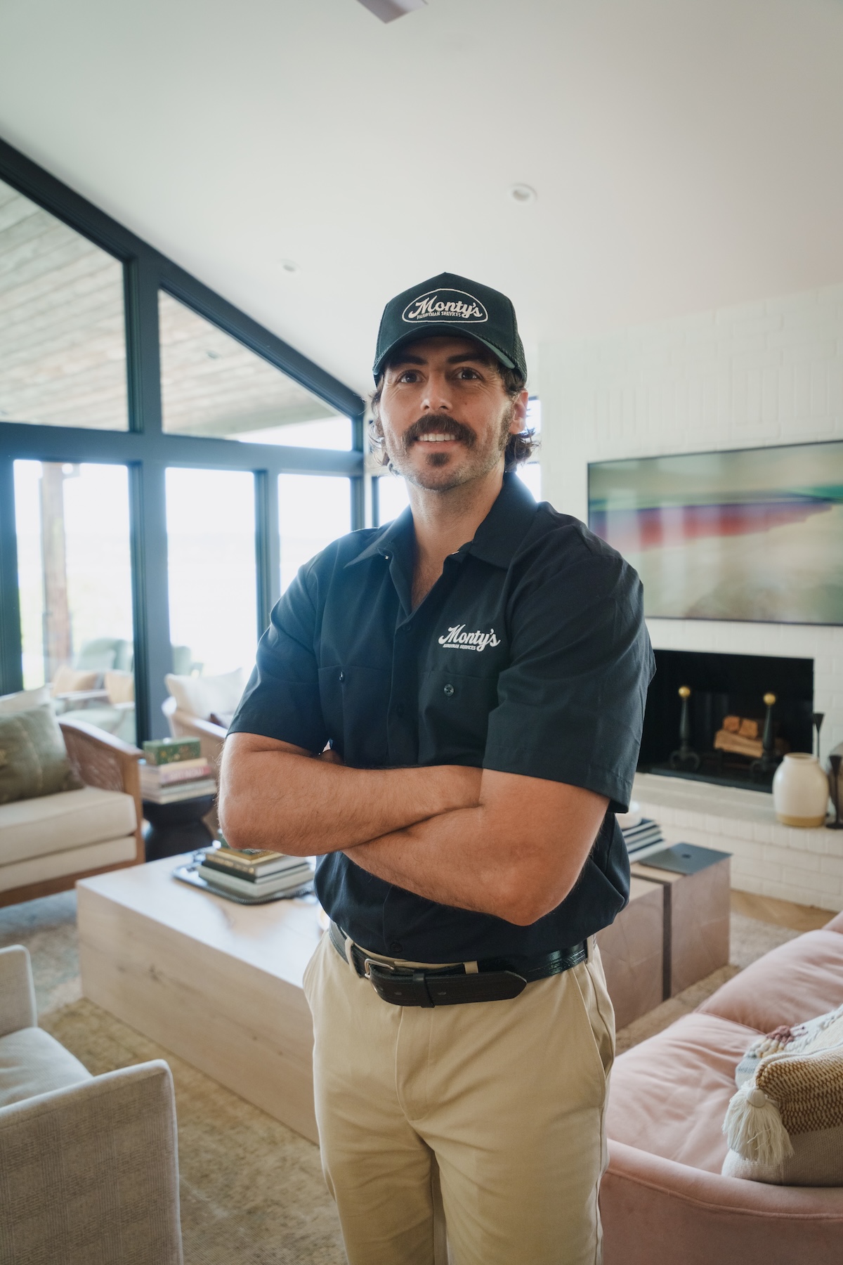 Monty's team member standing in a homeowner's living room