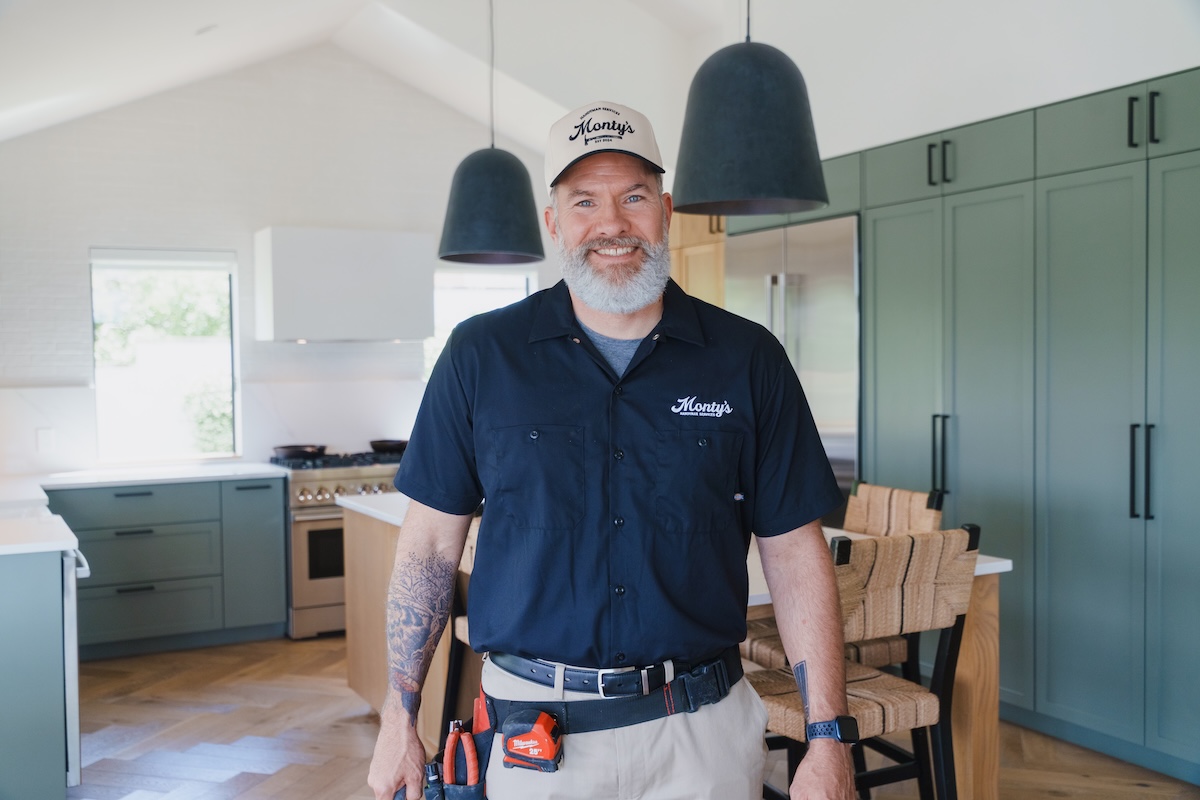 Monty's handyman standing in a kitchen ready to help